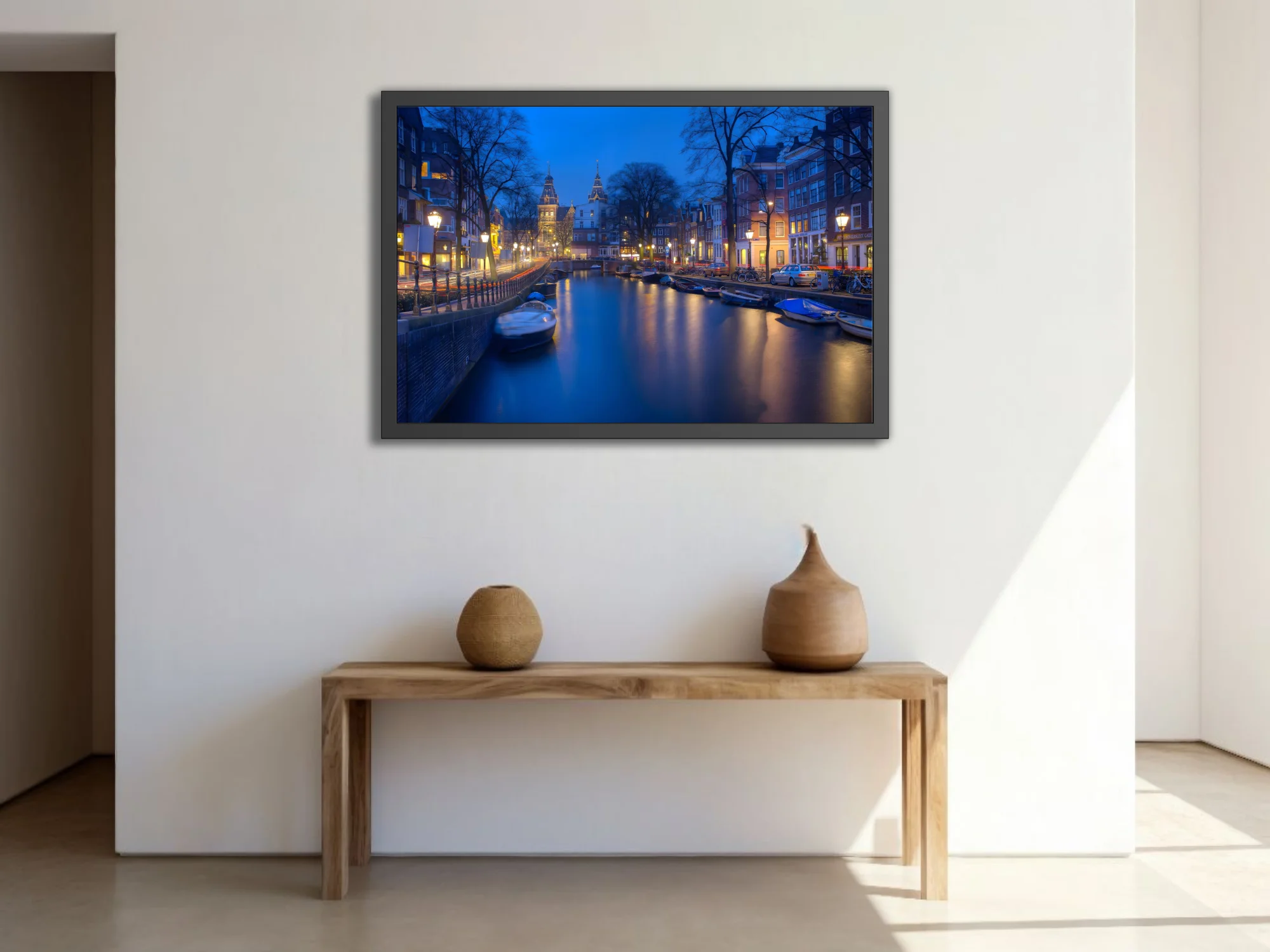 Amsterdam canal at twilight, long-exposure photo with blue tones and golden lantern reflections