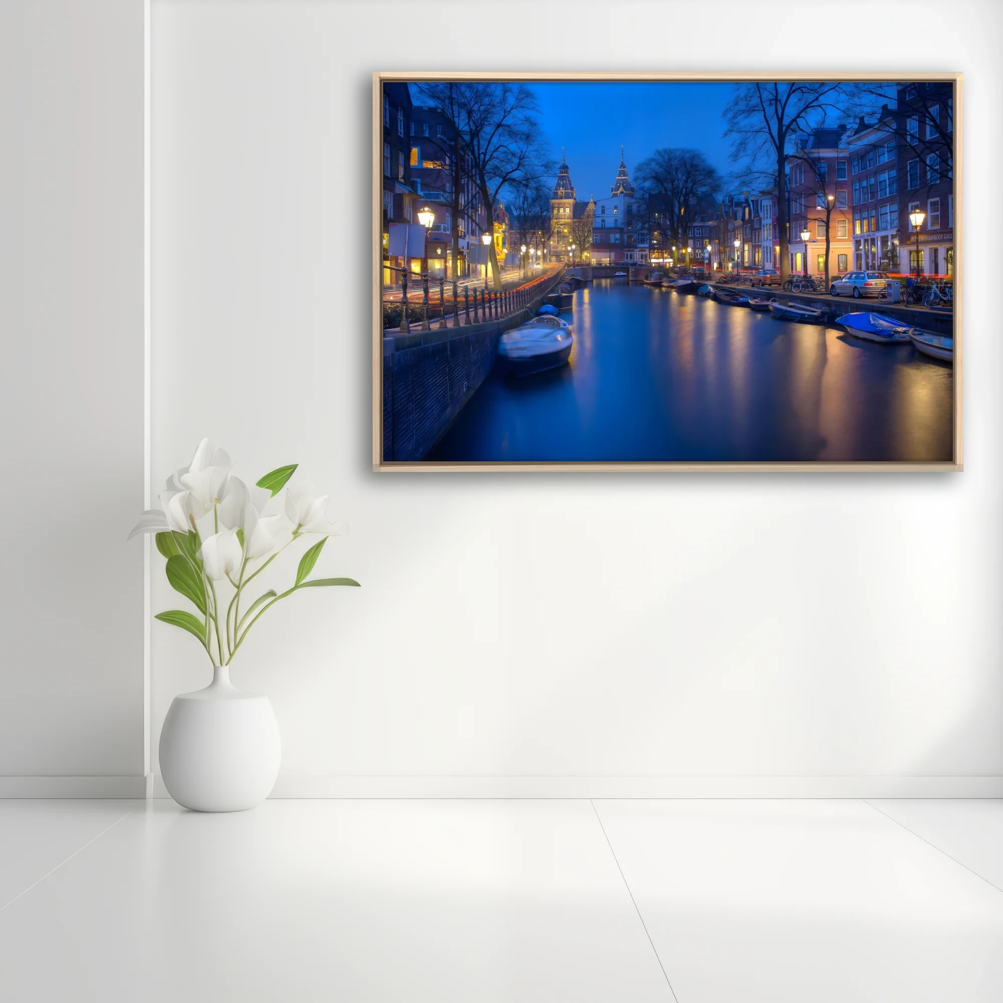 Amsterdam canal at twilight, long-exposure photo with blue tones and golden lantern reflections