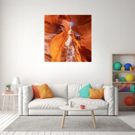 Canyon art, swirling amber sandstone with a blue sky opening