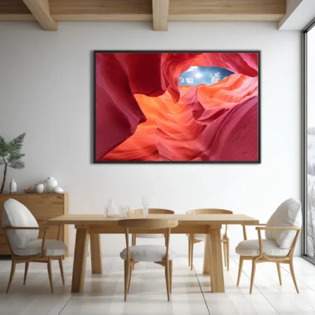 Canyon interior with glowing red sandstone and blue sky opening