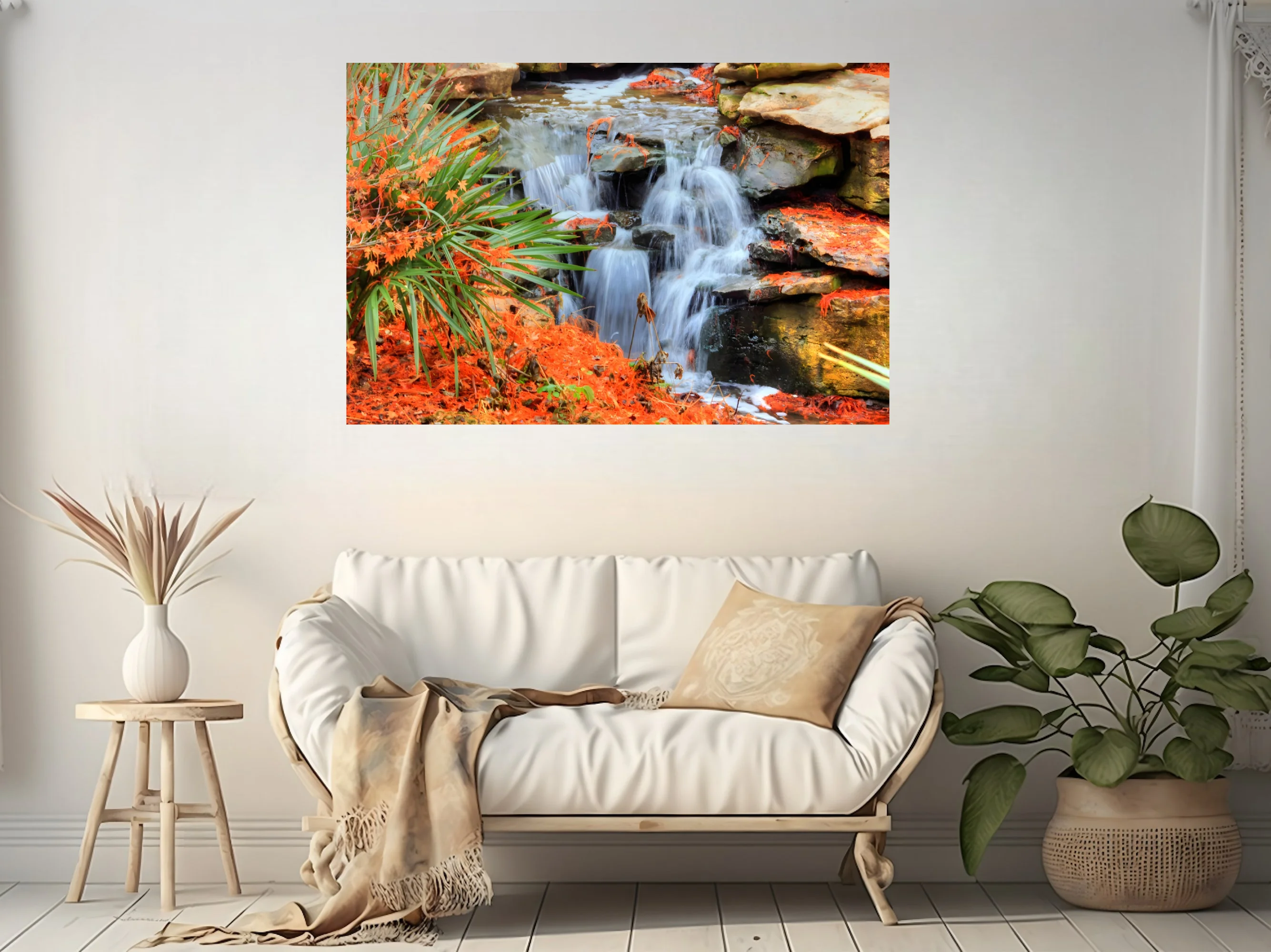 Cascading waterfall over mossy rocks with vivid orange foliage and green palms