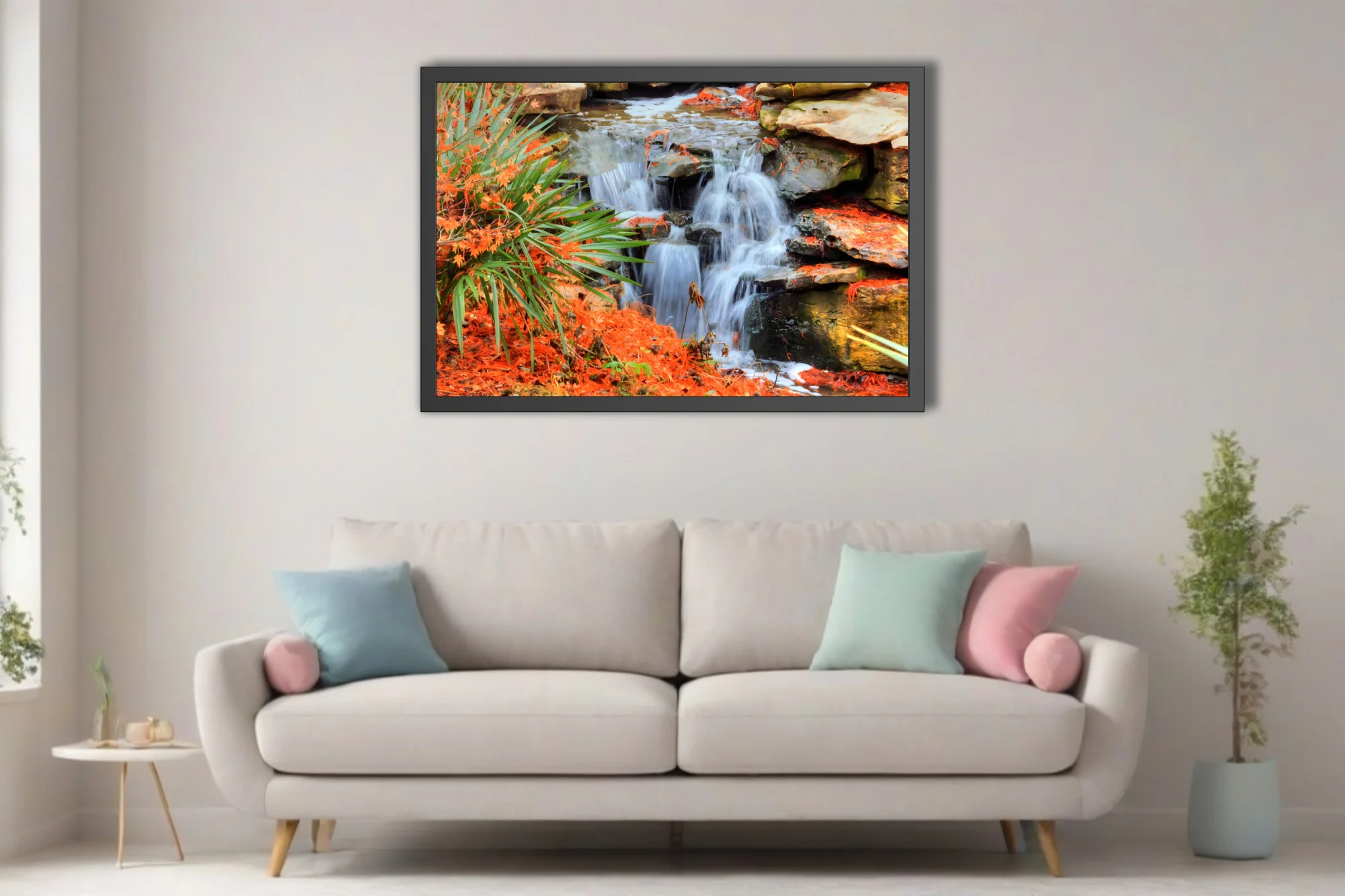 Cascading waterfall over mossy rocks with vivid orange foliage and green palms