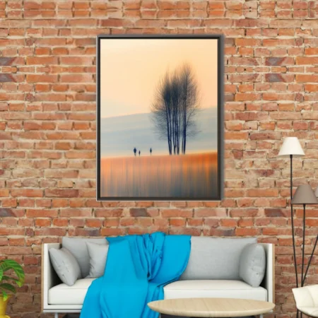 Minimalist autumn landscape with misty blur, amber tones, bare trees and silhouetted figures