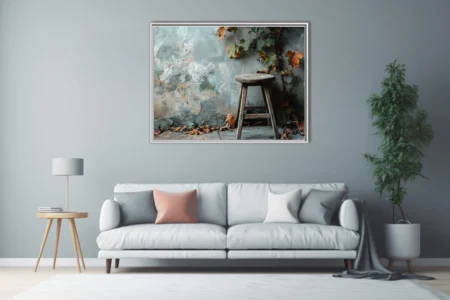 Rustic autumn still life, weathered wooden stool and turning foliage against aged plaster wall