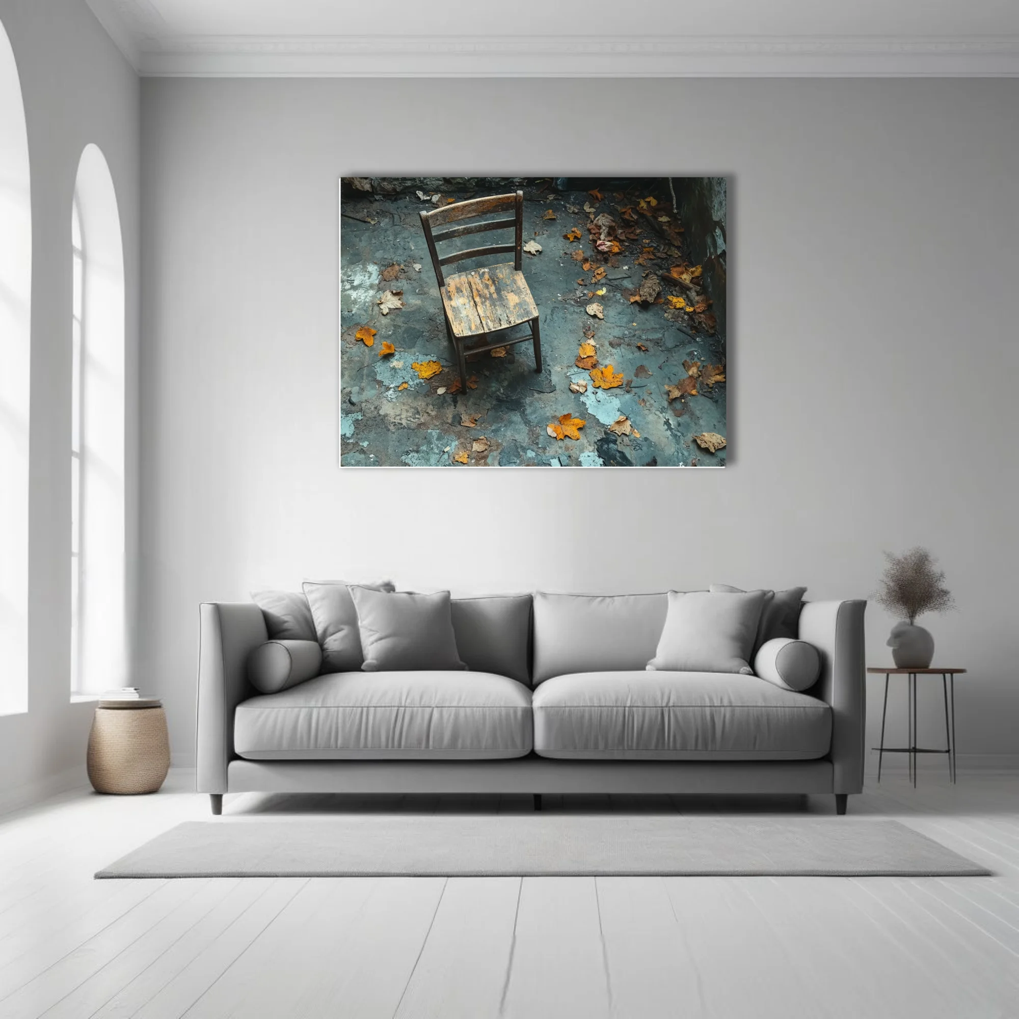 Weathered wooden chair among autumn leaves in abandoned decayed interior, moody blue-grey tones