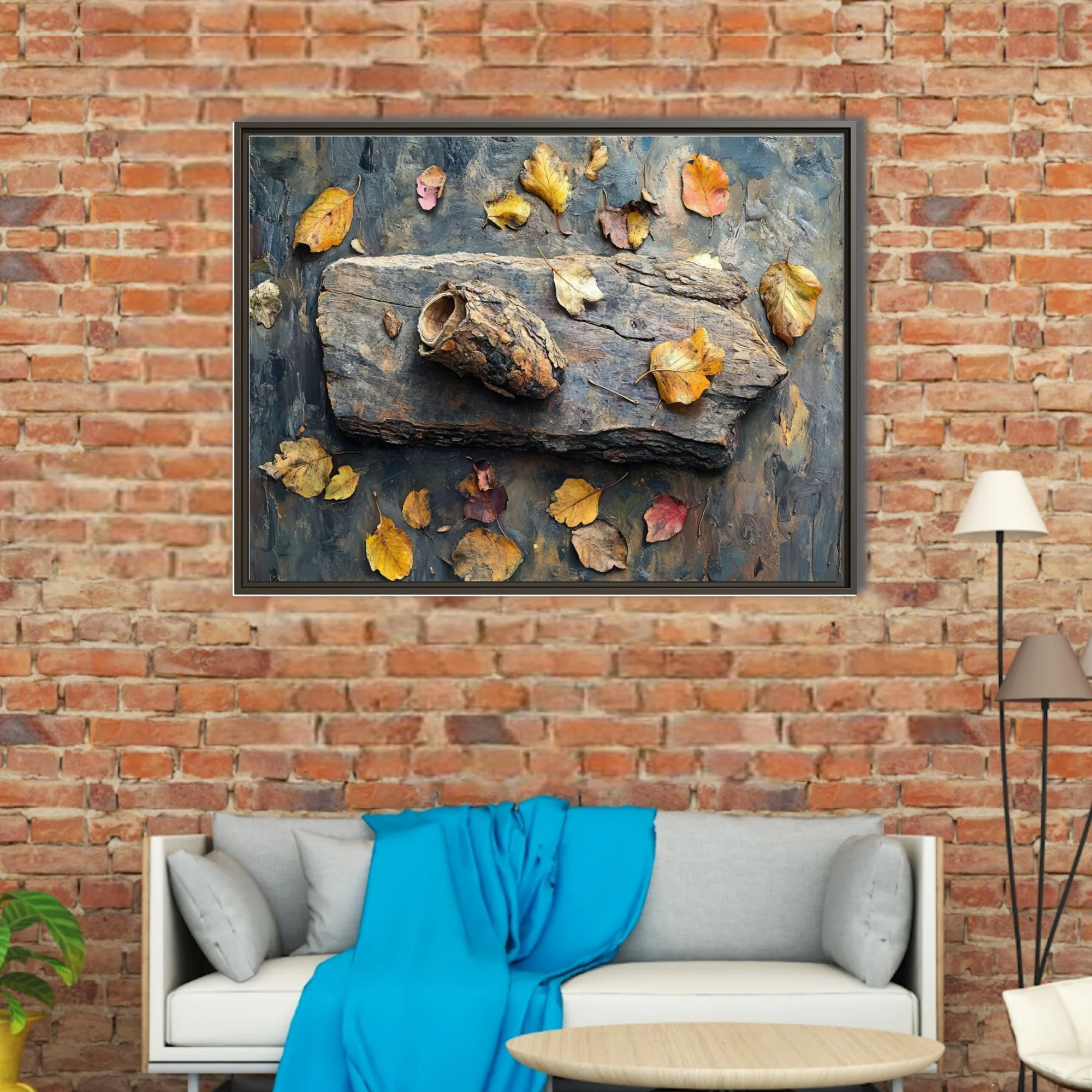 Autumn still life with driftwood, dried leaves, earthy ochres and steel blue