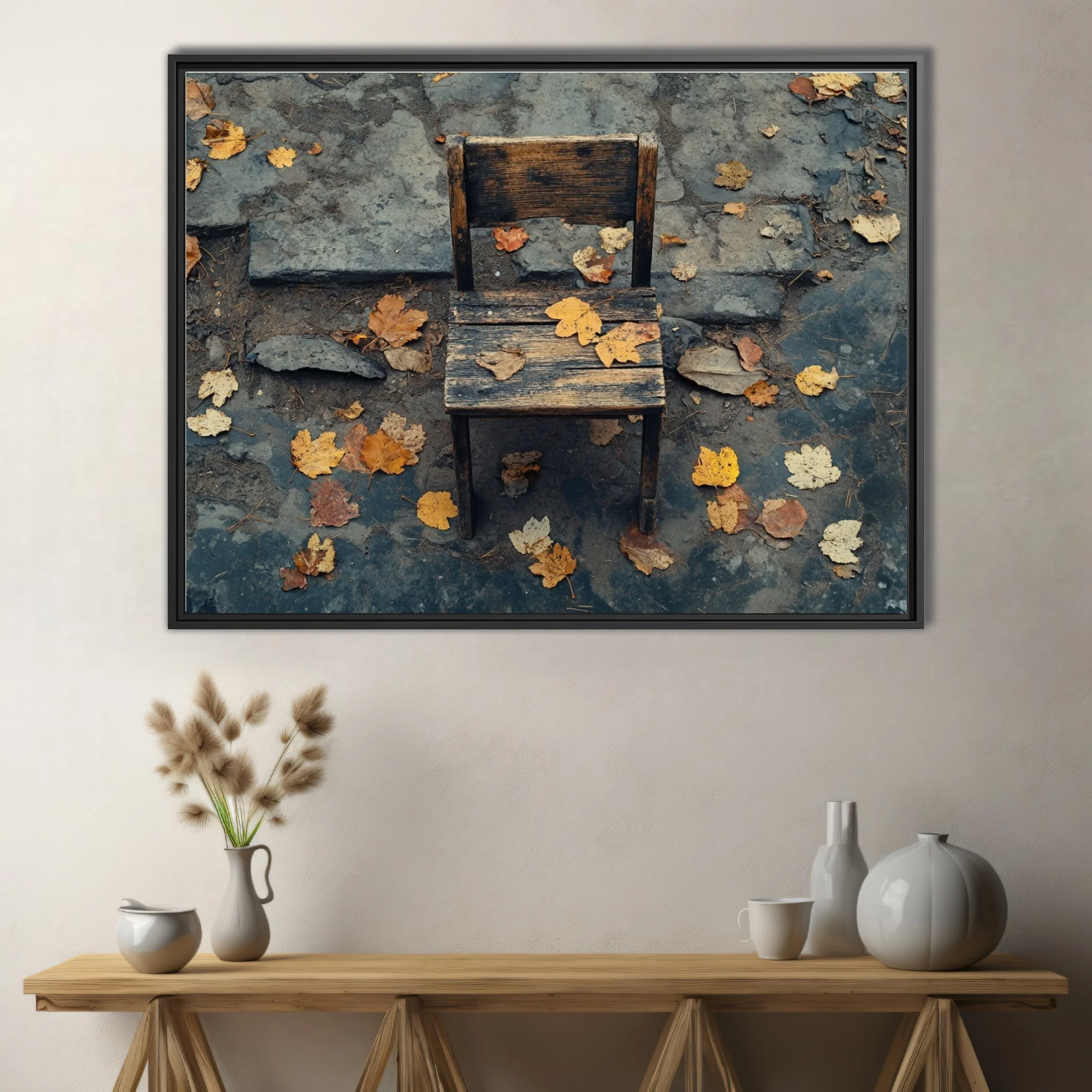 Weathered wooden chair on stone pavement with scattered autumn leaves, moody earth tones
