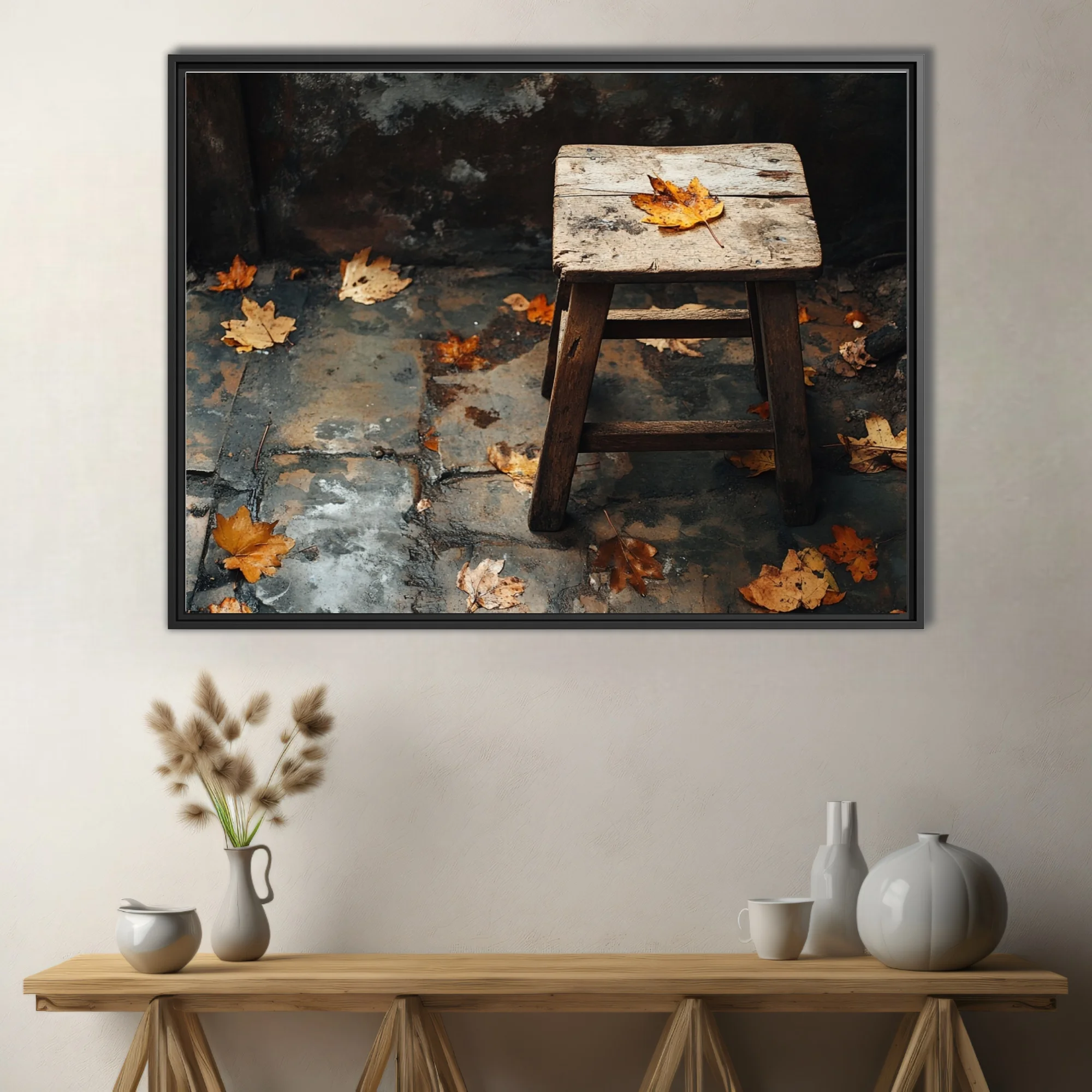 Rustic wooden stool with fallen autumn leaves on weathered stone — moody seasonal still life
