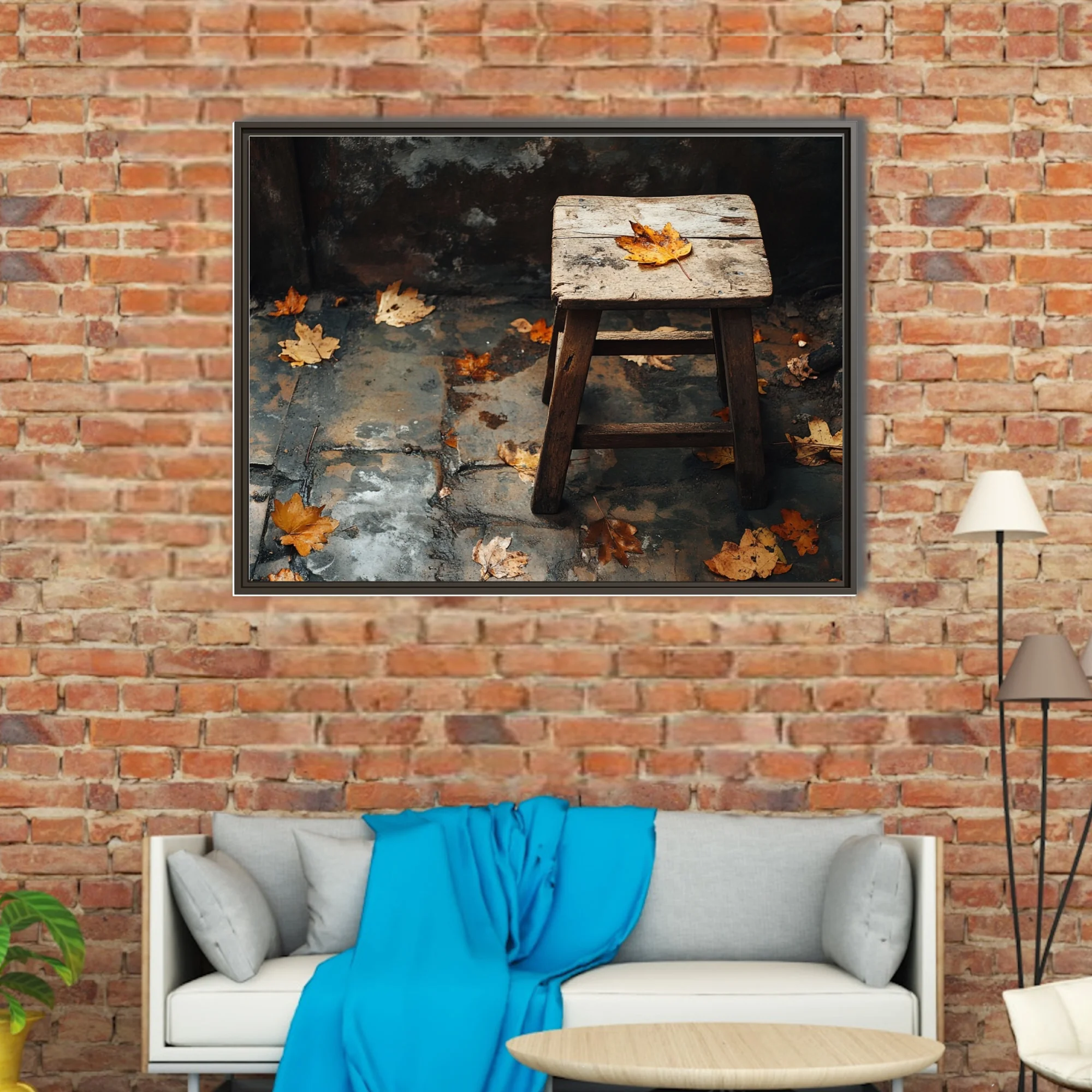 Rustic wooden stool with fallen autumn leaves on weathered stone — moody seasonal still life