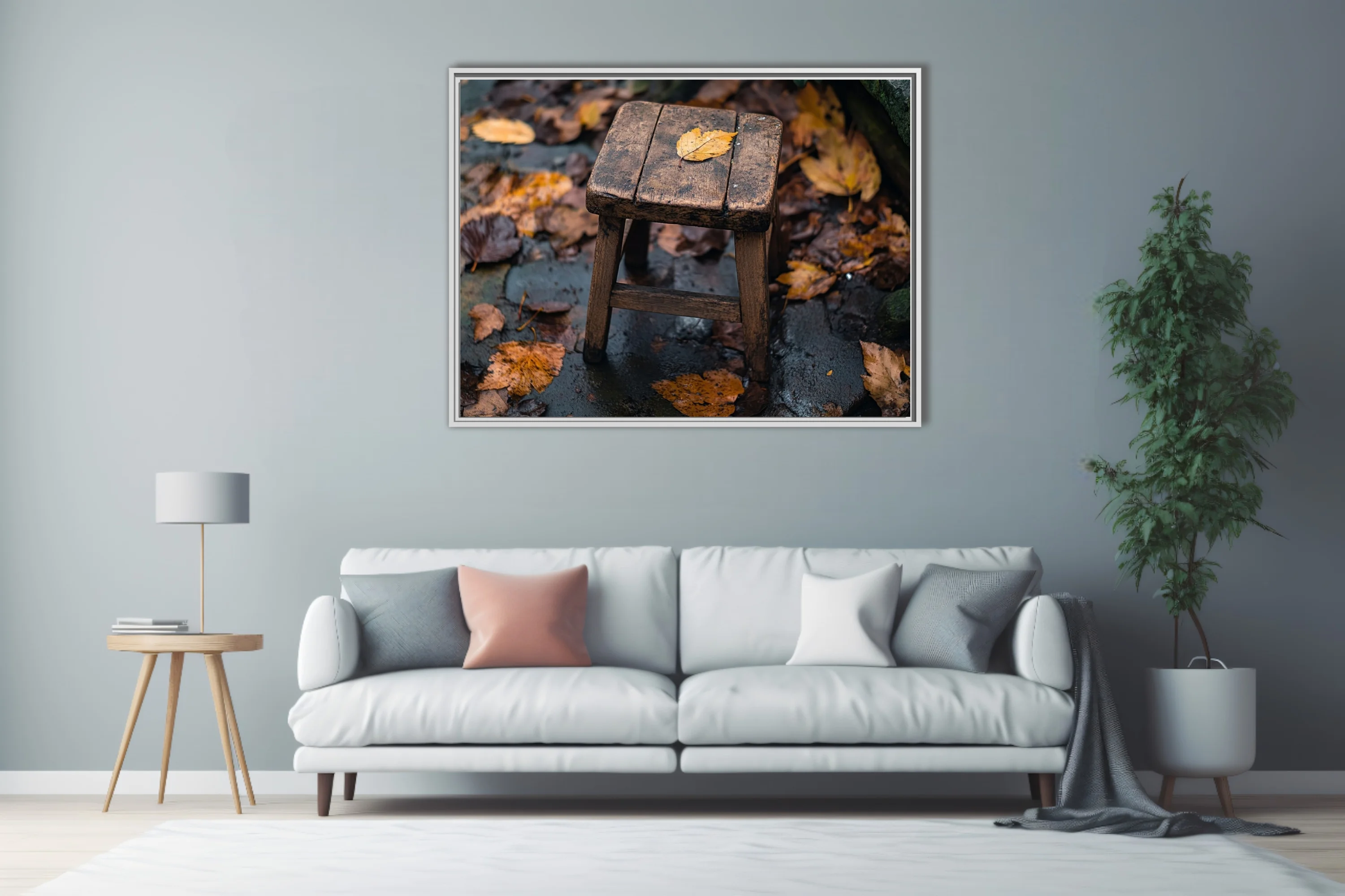 Rustic wooden stool with fallen autumn leaf on rain-wet stone surrounded by foliage