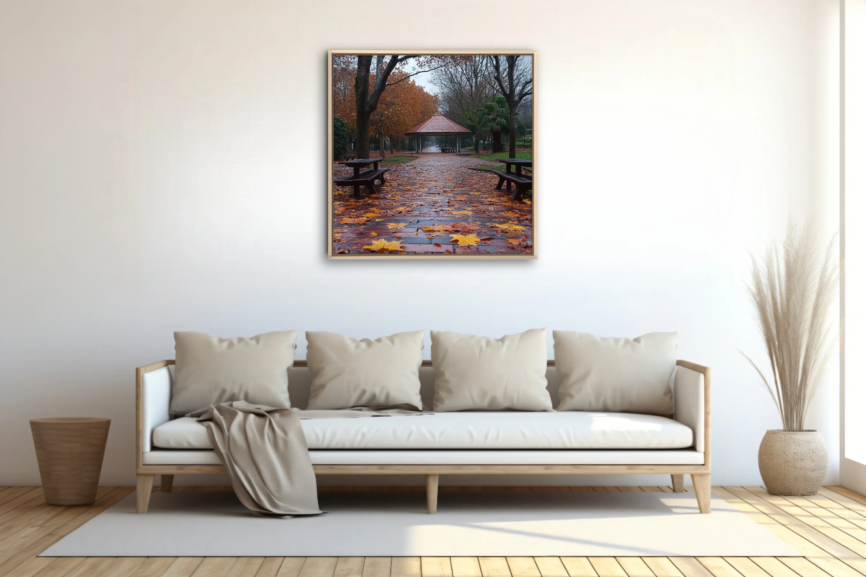 Rainy autumn park path with fallen leaves, picnic tables, and a gazebo in muted amber and grey