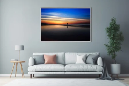 Minimalist twilight seascape silhouette reflected on wet sand, blue-orange sunset palette