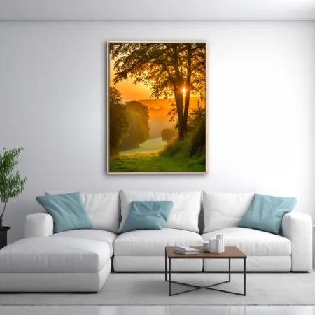 Golden misty sunrise through woodland trees, amber glow, lush green landscape