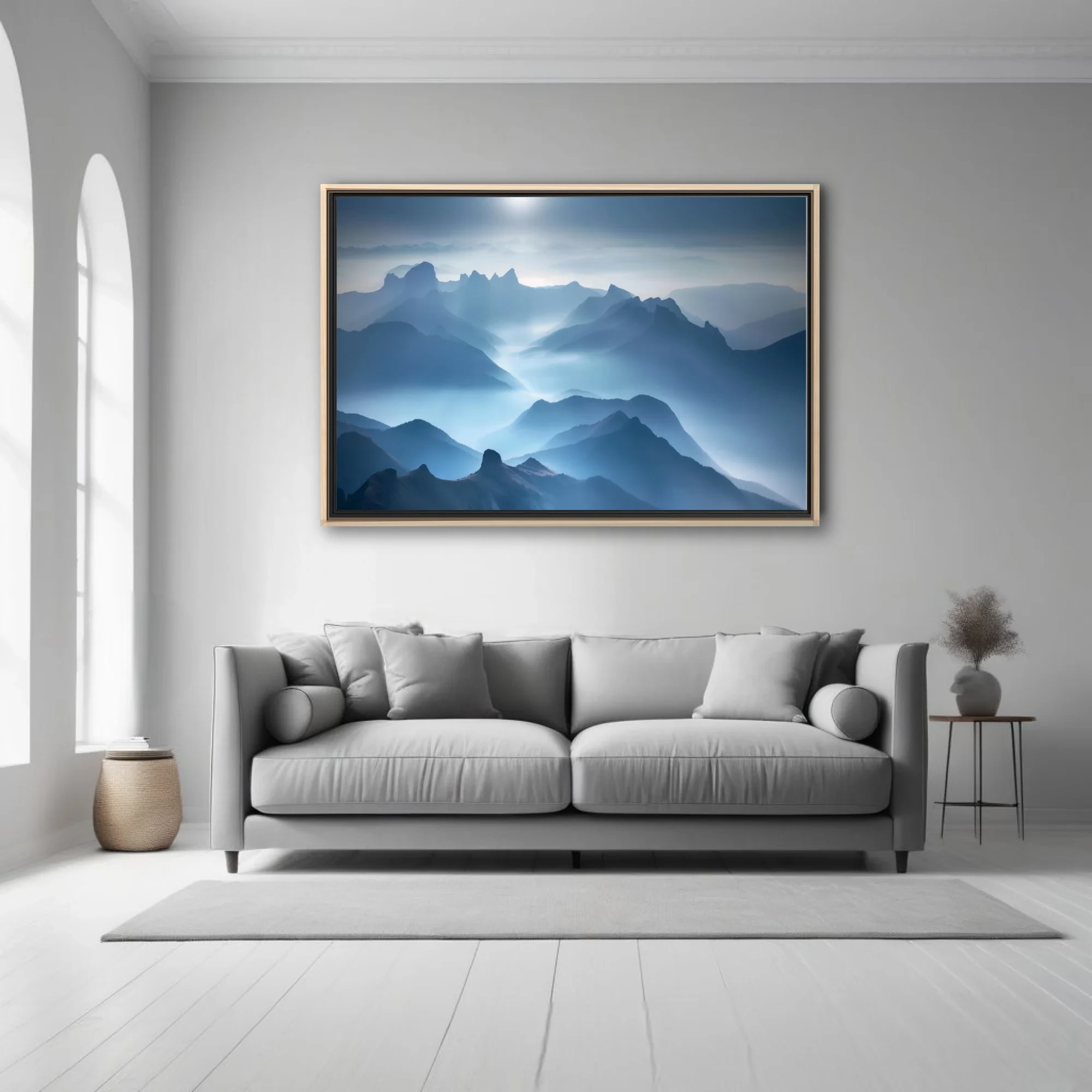 Misty blue mountain landscape with layered peaks and ethereal diffused light