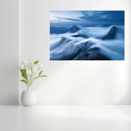Long-exposure cloudscape flowing over mountain ridges in deep blue tones