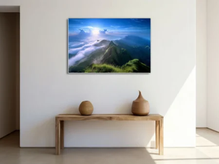 Mountain landscape above clouds, vivid blue sky and lush green ridgelines