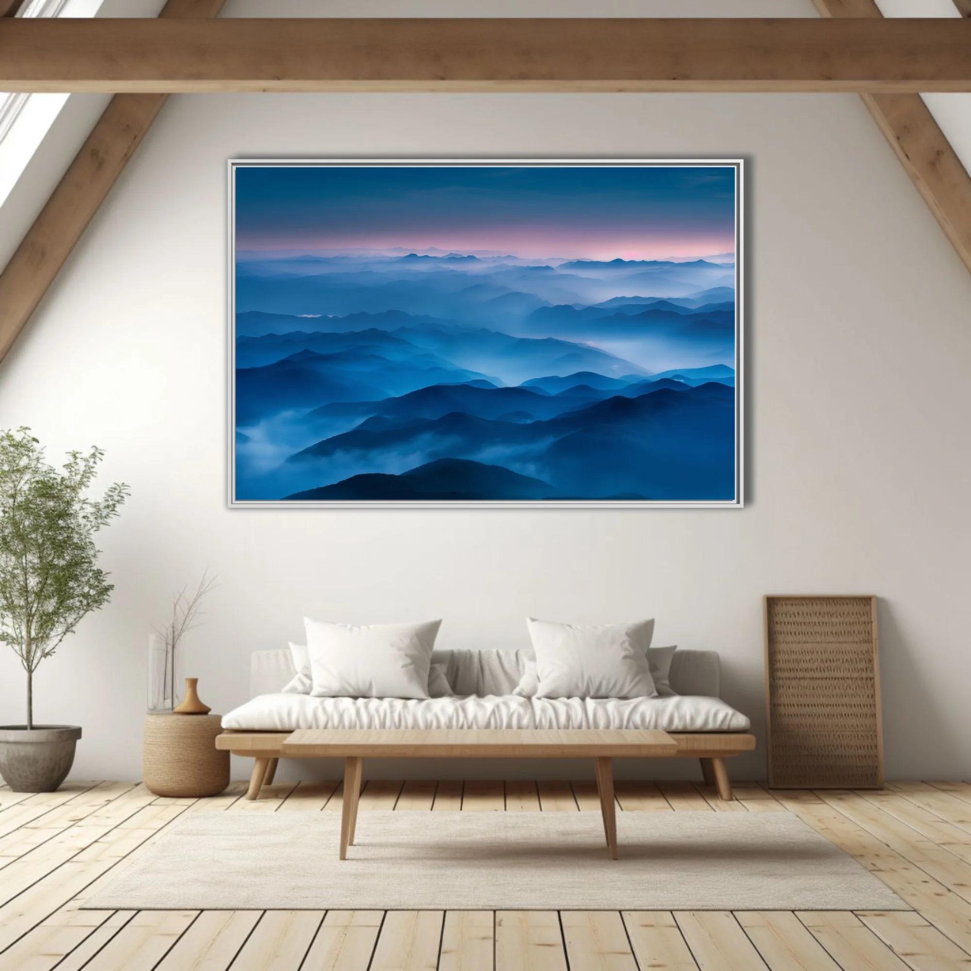 Misty blue mountain ranges at twilight, layered ridgelines fading into pink dusk sky