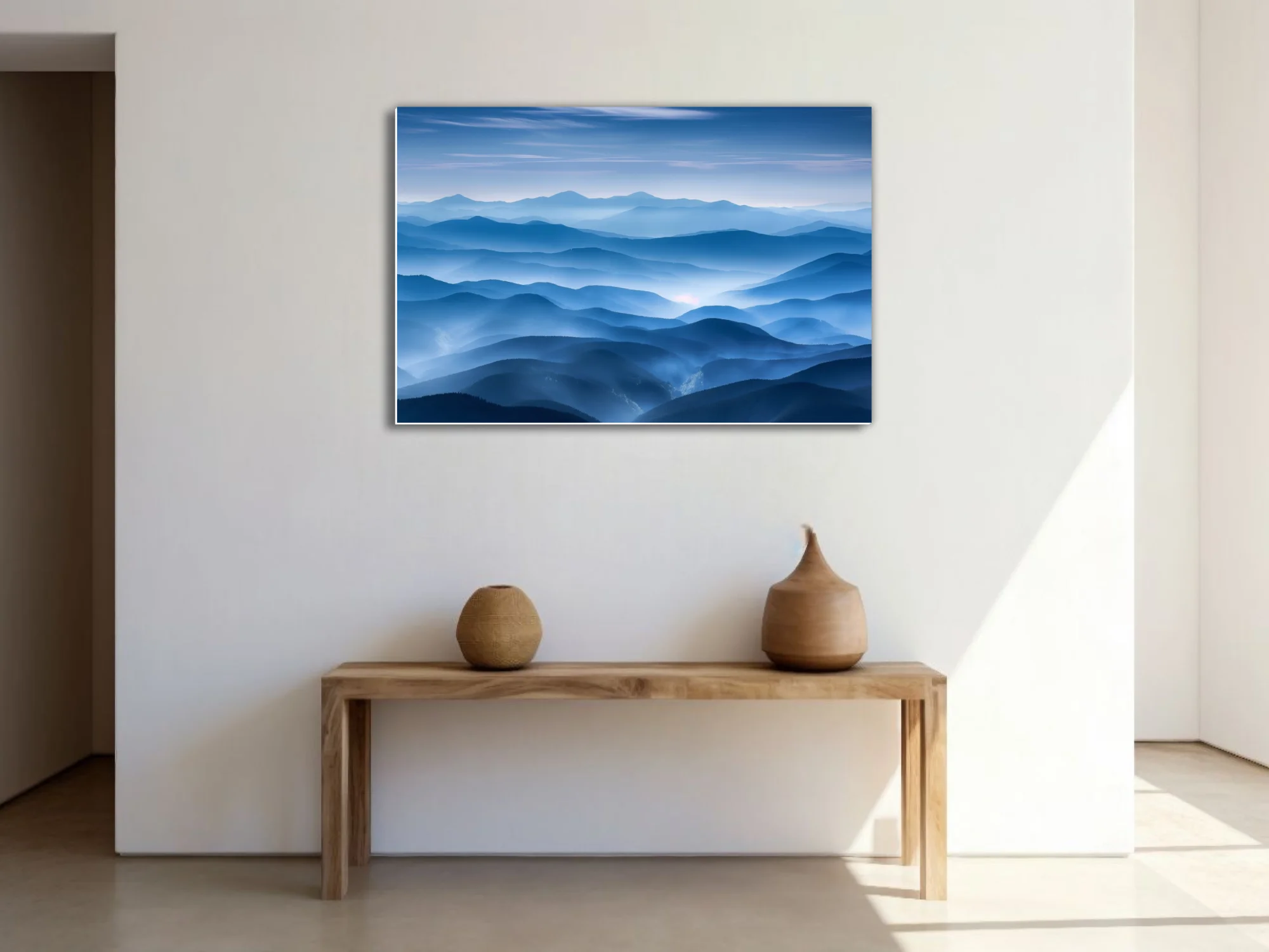 Misty layered mountain landscape in cool blue tones with atmospheric haze and soft glow