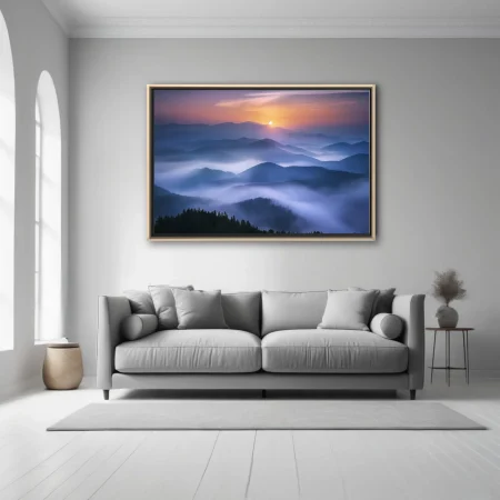 Misty mountain landscape at sunrise with layered blue fog and warm horizon glow