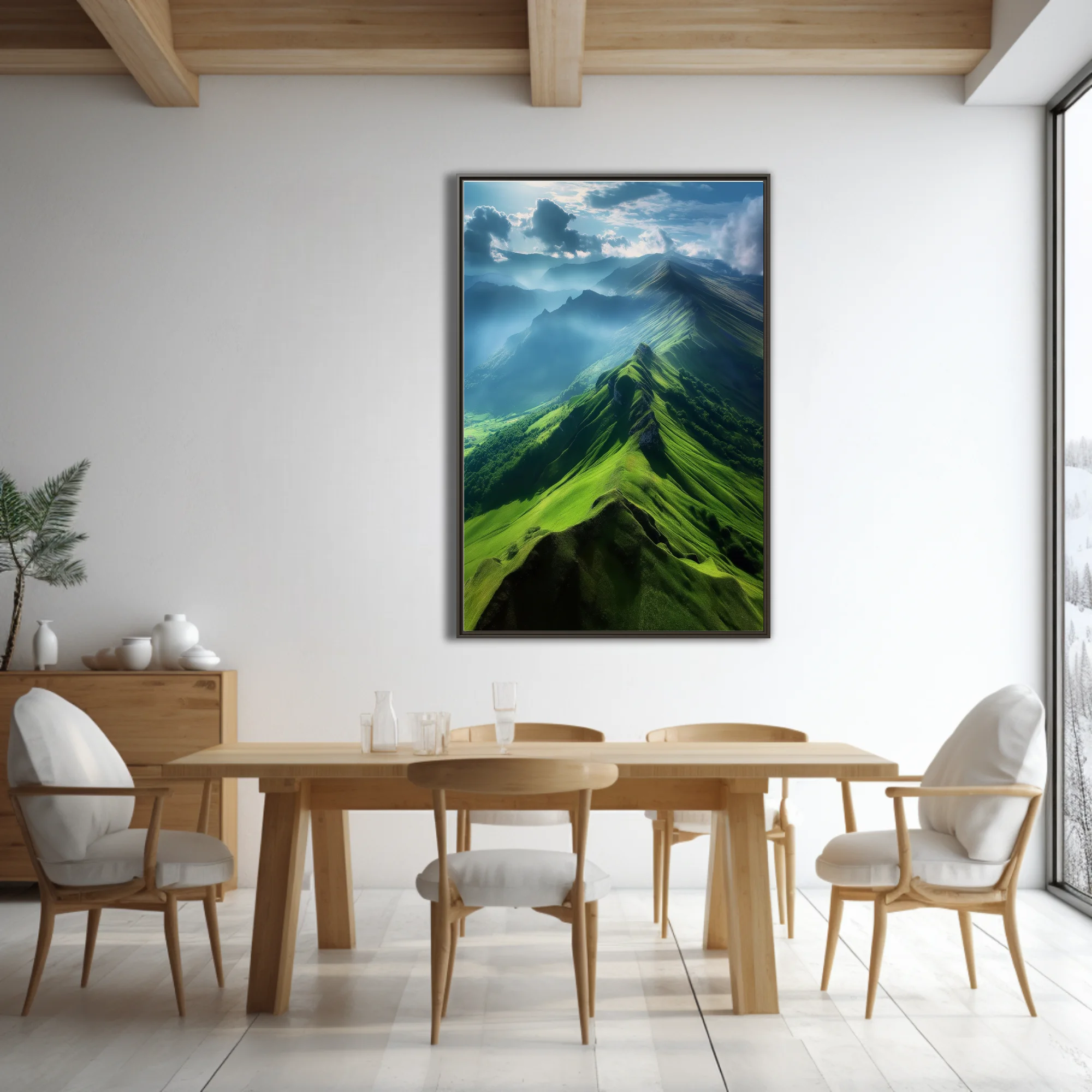 Aerial green mountain ridgeline with dramatic clouds and misty valleys