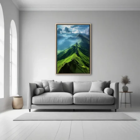 Aerial green mountain ridgeline with dramatic clouds and misty valleys