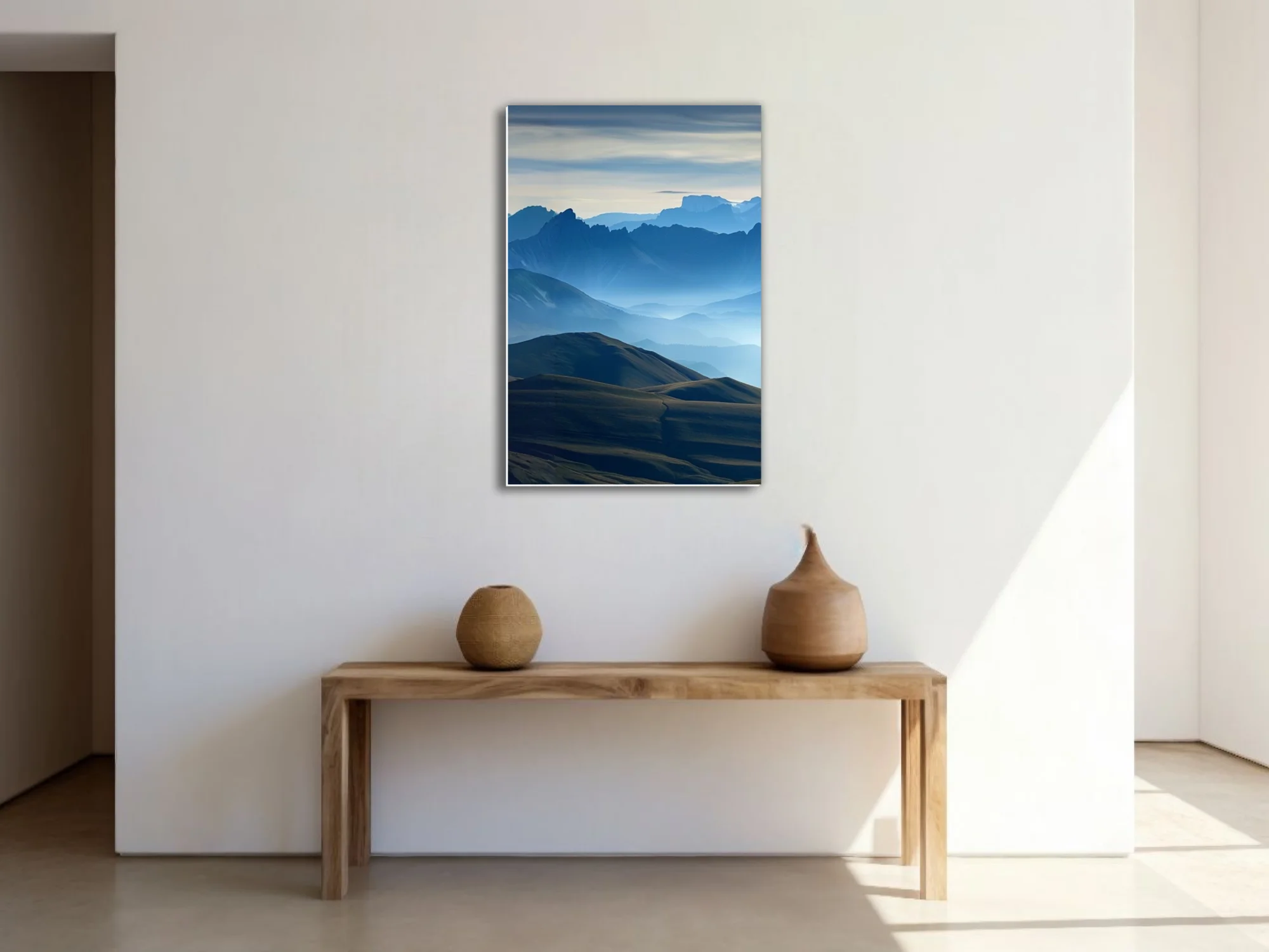 Misty blue mountain ranges with layered ridgelines and atmospheric haze