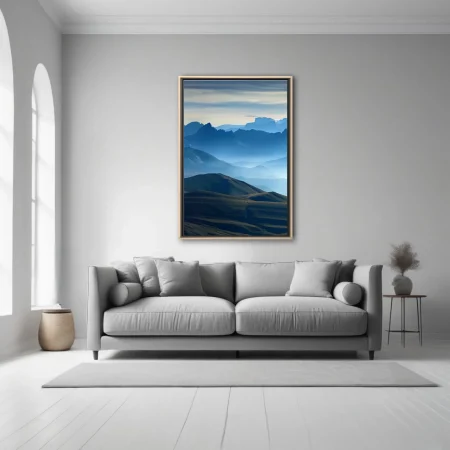 Misty blue mountain ranges with layered ridgelines and atmospheric haze