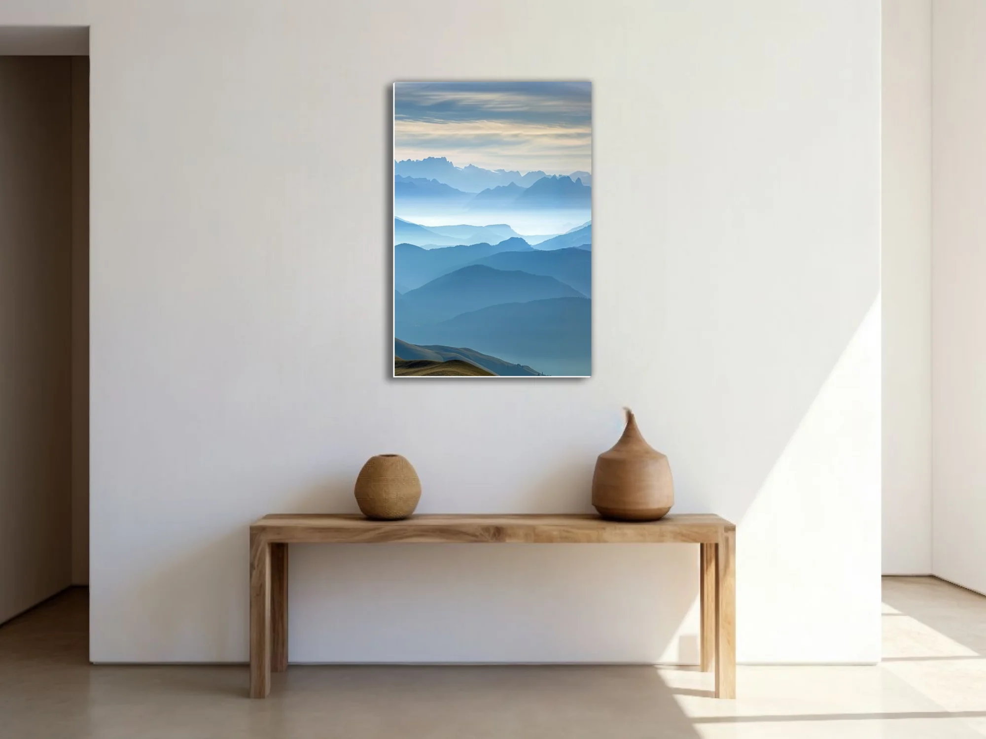 Misty blue layered mountain landscape with atmospheric haze and alpine ridgelines