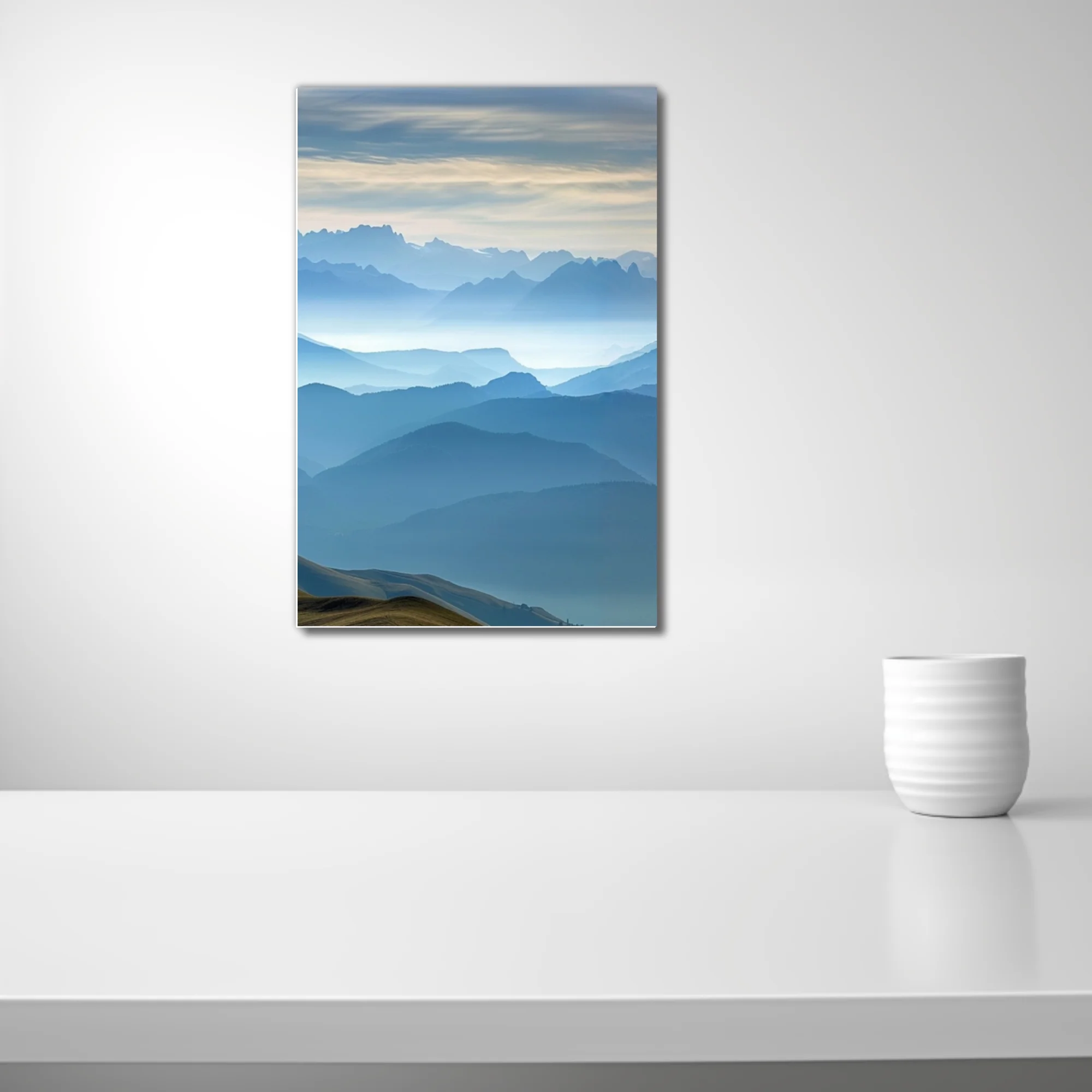 Misty blue layered mountain landscape with atmospheric haze and alpine ridgelines