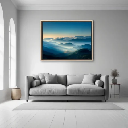 Misty mountain landscape at dawn, layered blue ridges and golden light