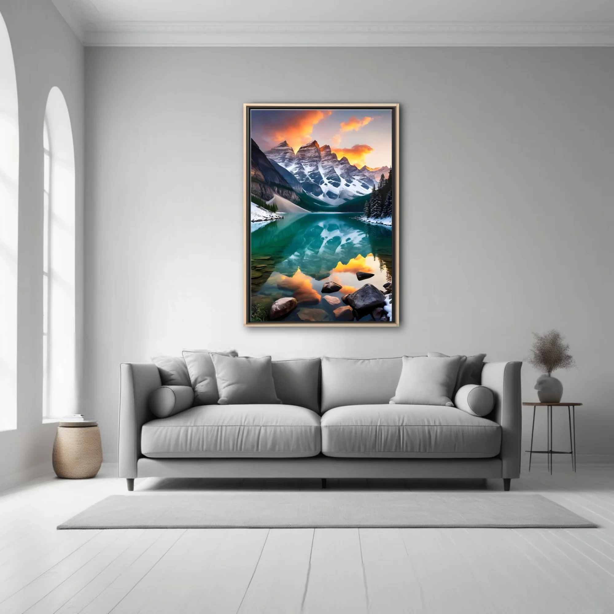Alpine lake with turquoise reflection, snow-capped peaks, and fiery sunset sky