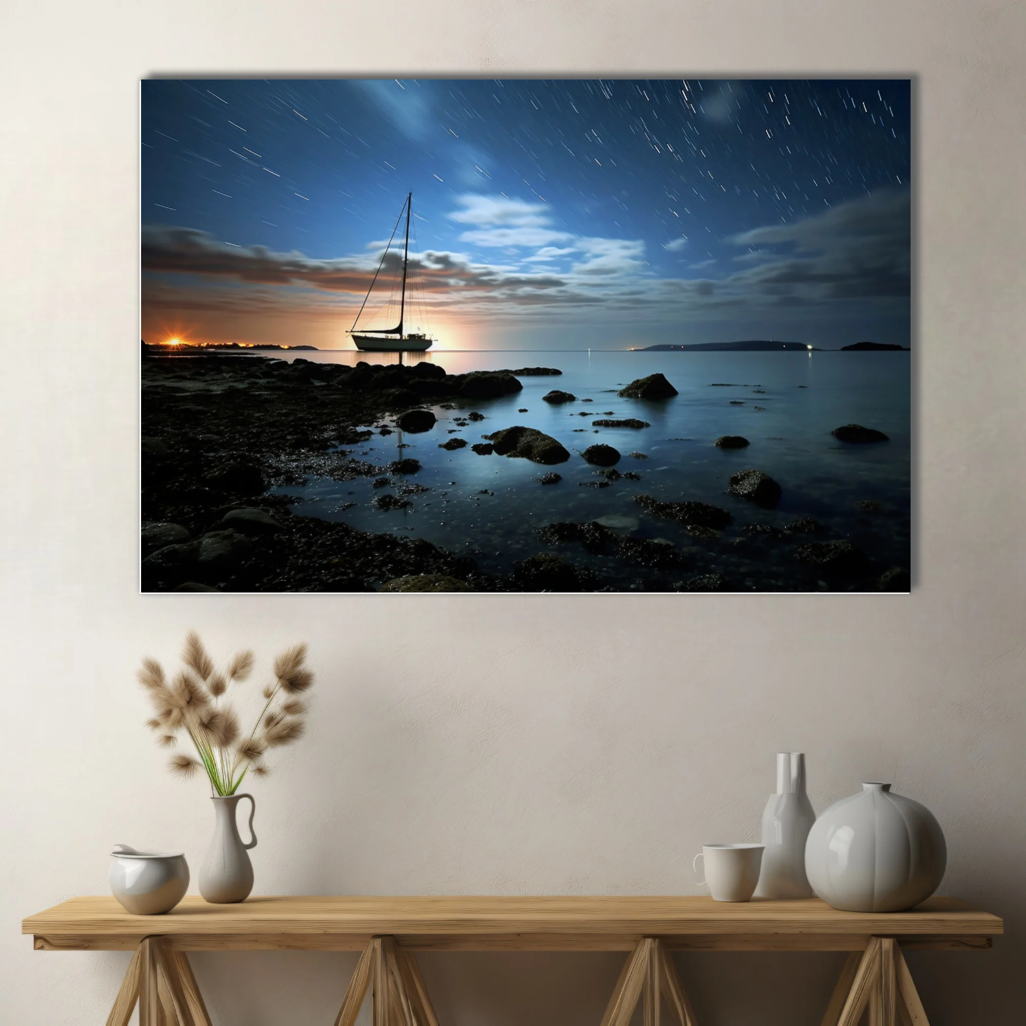 Long-exposure night seascape with sailboat silhouette, star trails, and glowing horizon