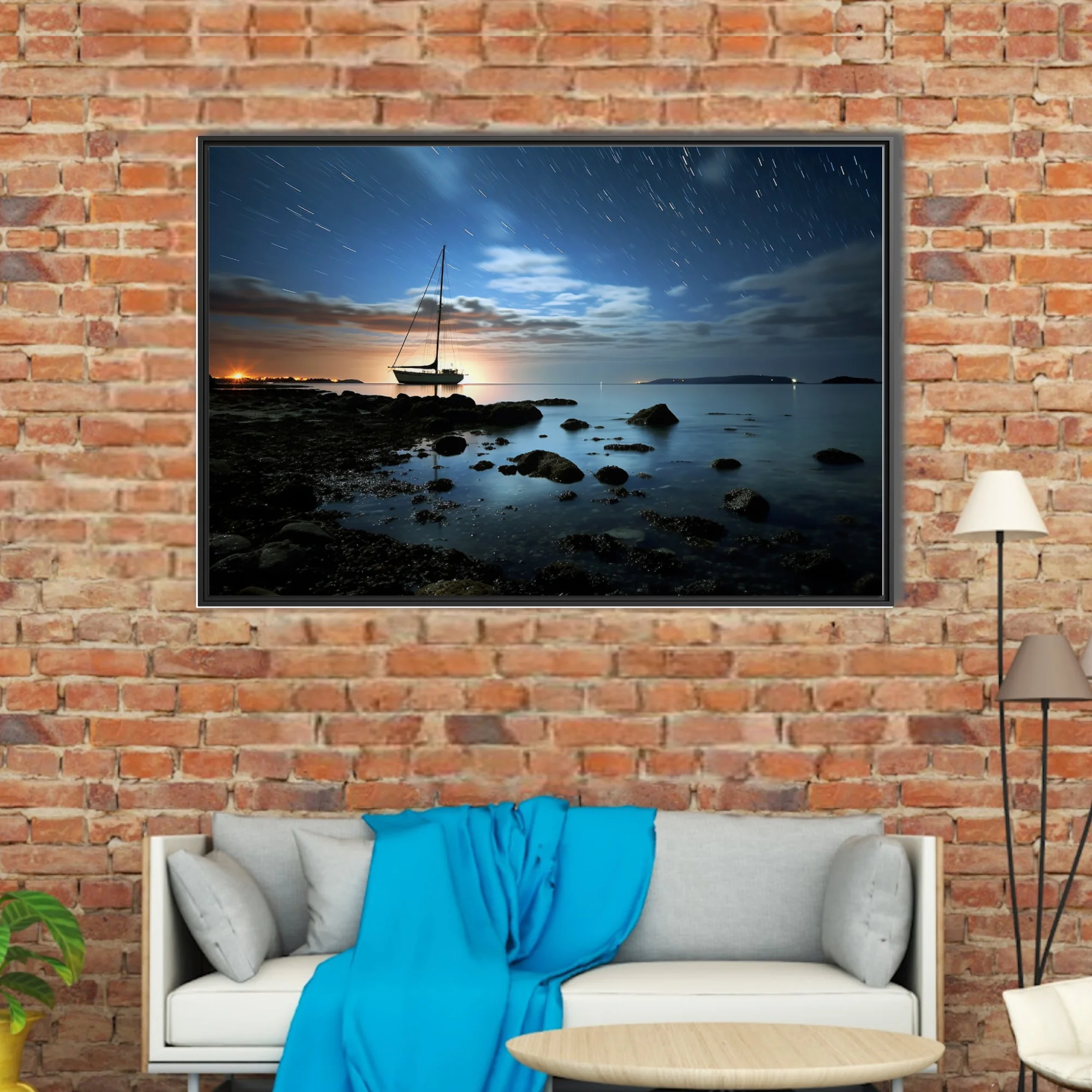 Long-exposure night seascape with sailboat silhouette, star trails, and glowing horizon