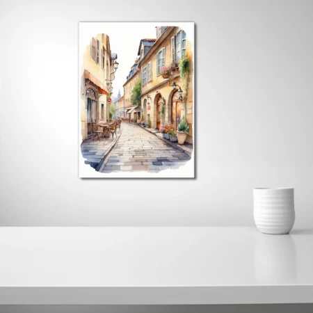Watercolor-style European village street with cobblestones, café tables, and flower-filled window boxes