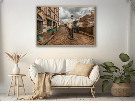 Moody Parisian cobblestone street with historic facades and overcast skies