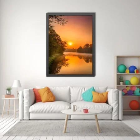 Misty river sunrise landscape with golden reflections and silhouetted trees