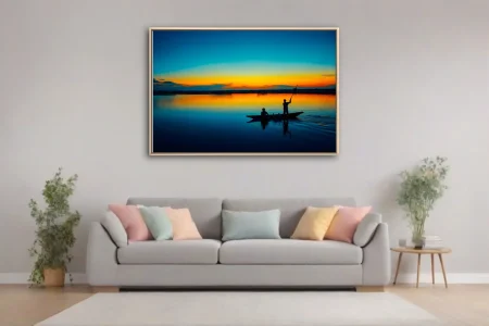 Cinematic sunset river scene with silhouetted boat figures and vivid amber-blue sky reflection