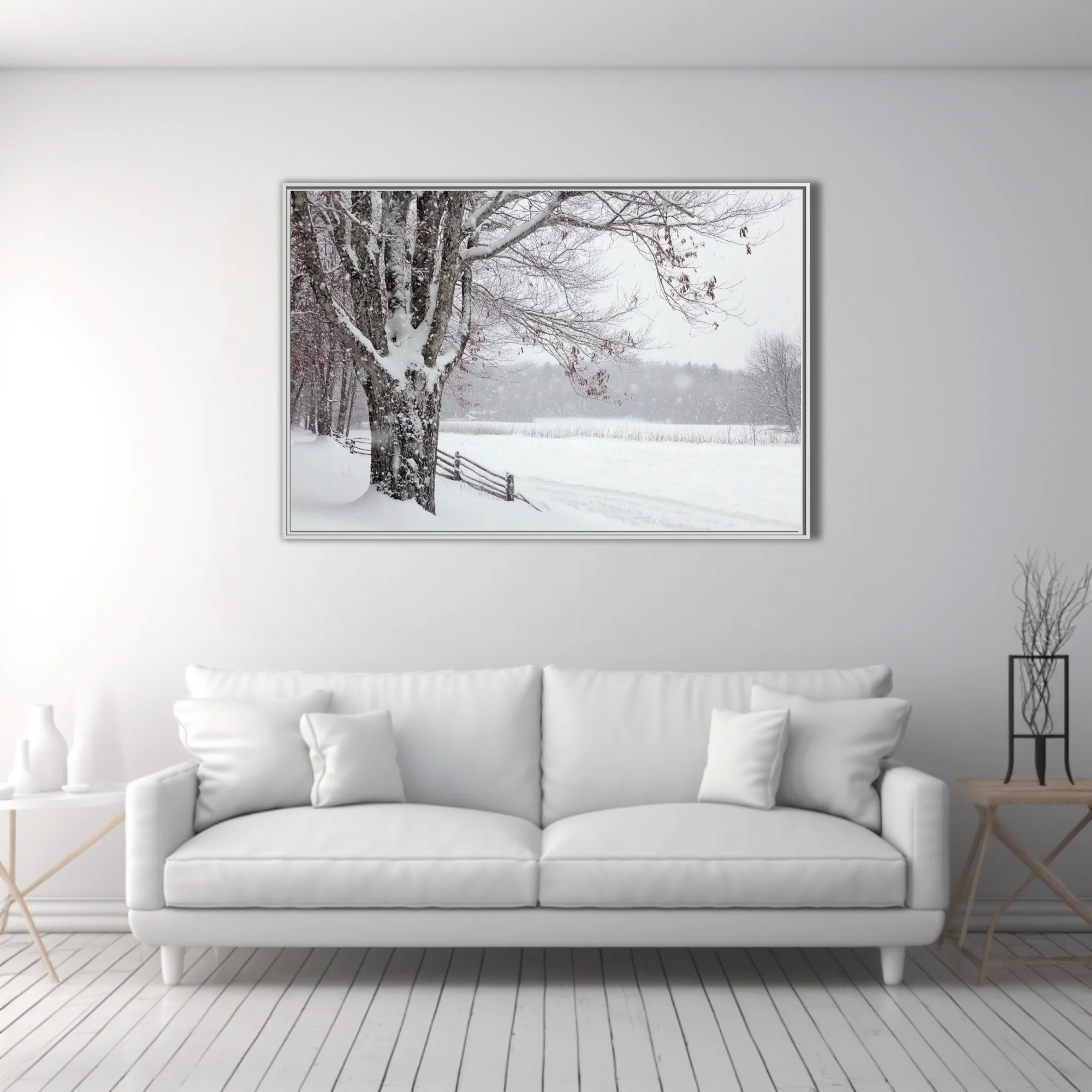 Snowy winter landscape with bare trees, wooden fence, and blizzard snowfall