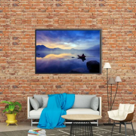 Misty mountain lake at twilight with lone figure in rowboat, cobalt and gold palette