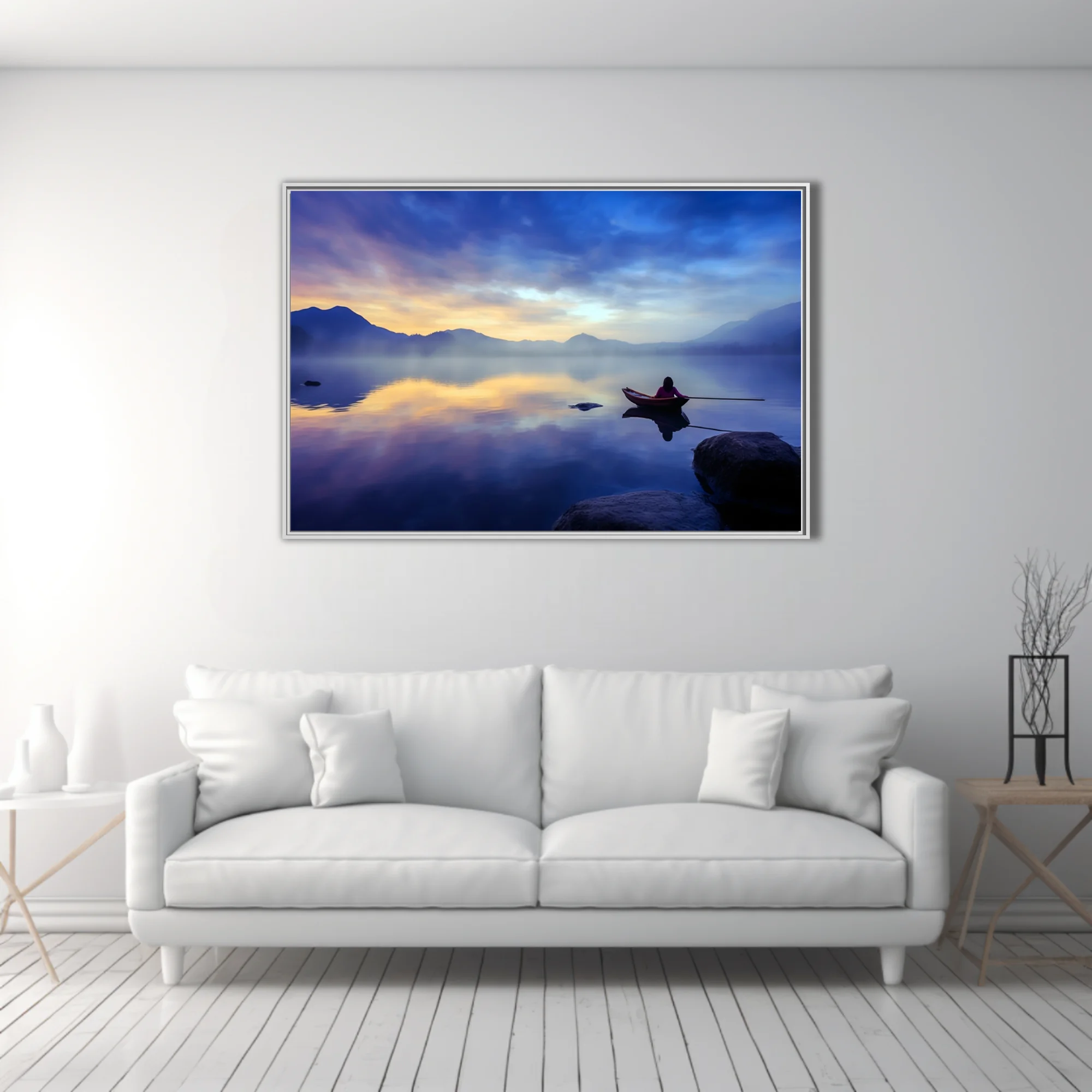 Misty mountain lake at twilight with lone figure in rowboat, cobalt and gold palette