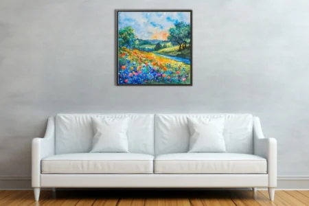 Vibrant watercolor-style wildflower meadow with rolling hills, winding stream, and sunlit sky