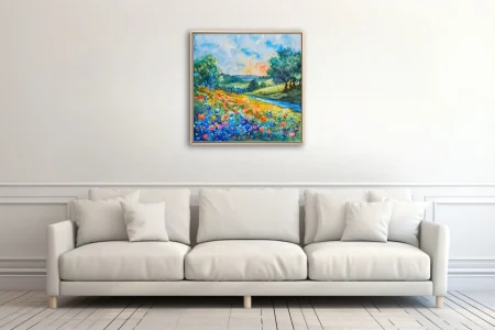 Vibrant watercolor-style wildflower meadow with rolling hills, winding stream, and sunlit sky