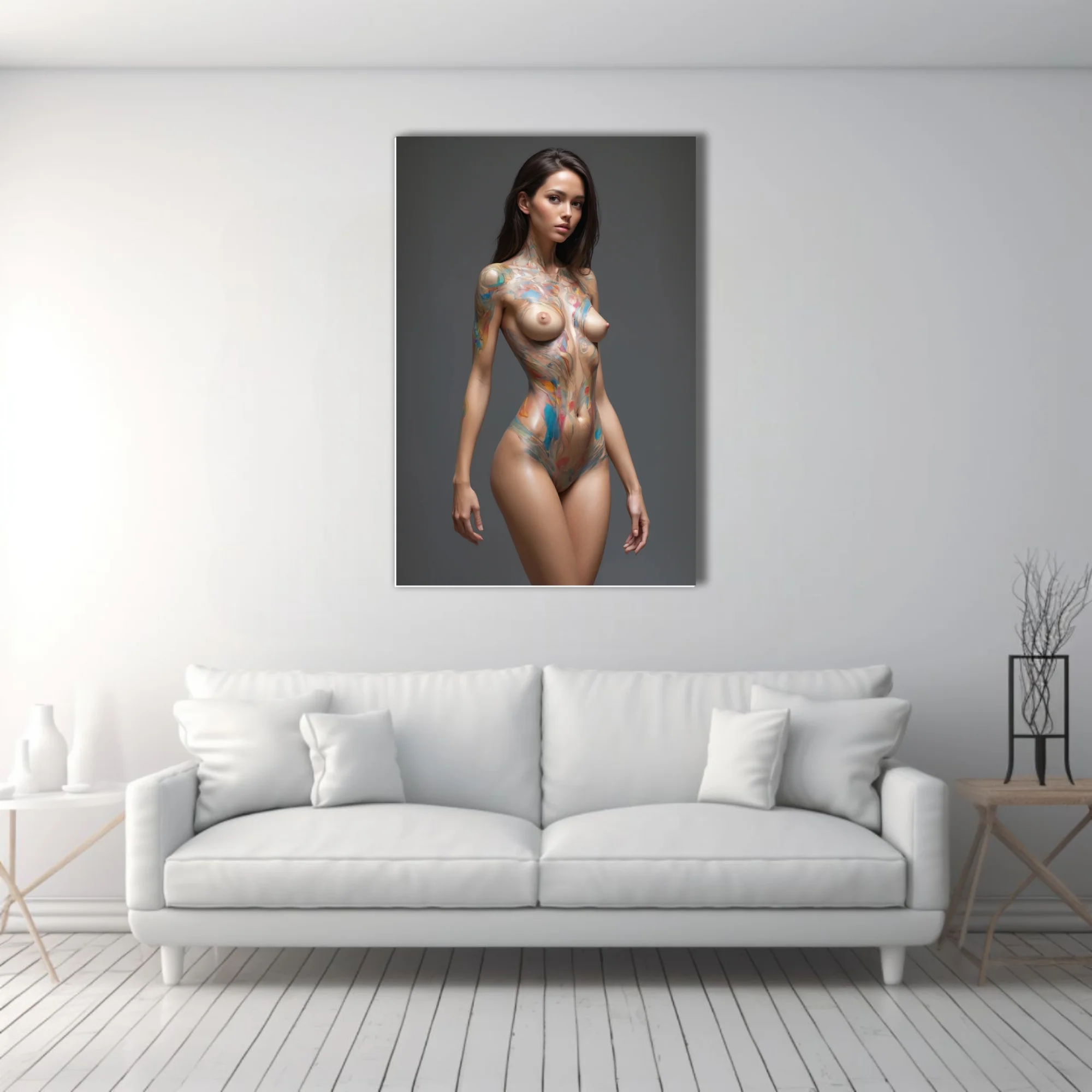 Nude woman streaked with vivid blue and orange body paint against a deep slate-grey backdrop