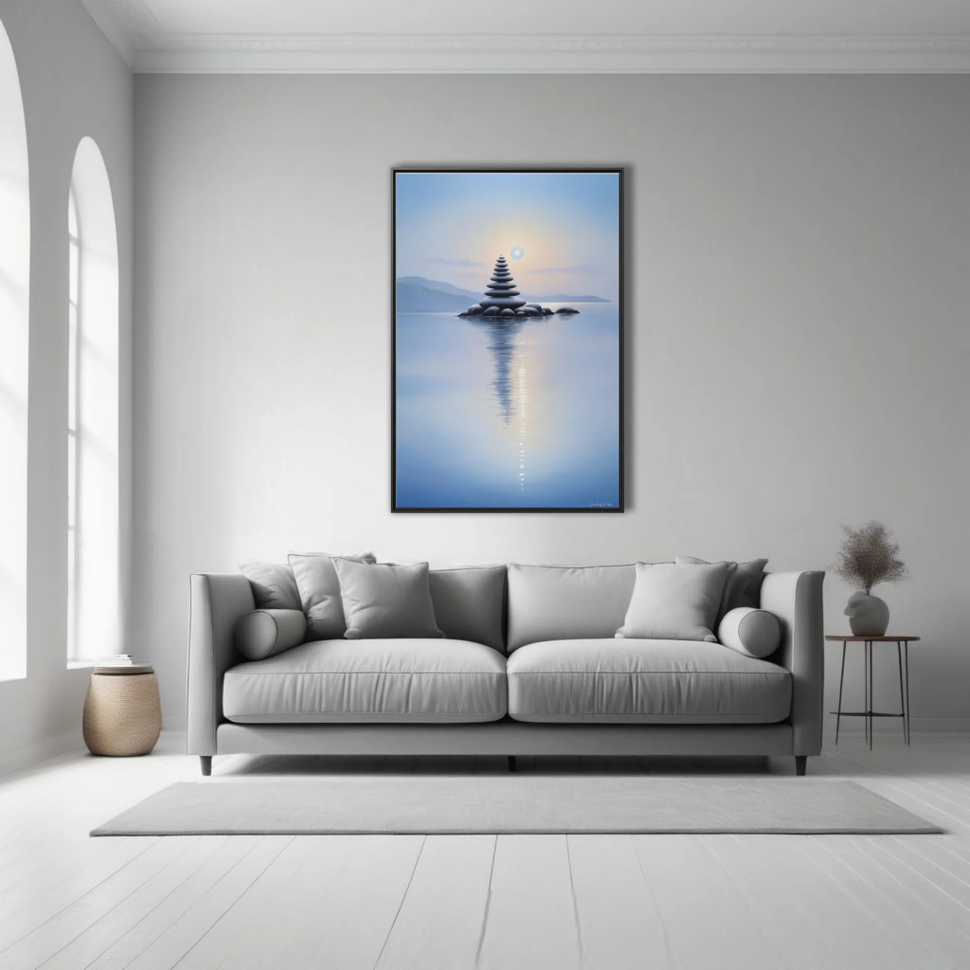 Minimalist zen stone stack reflected in calm blue water at dusk