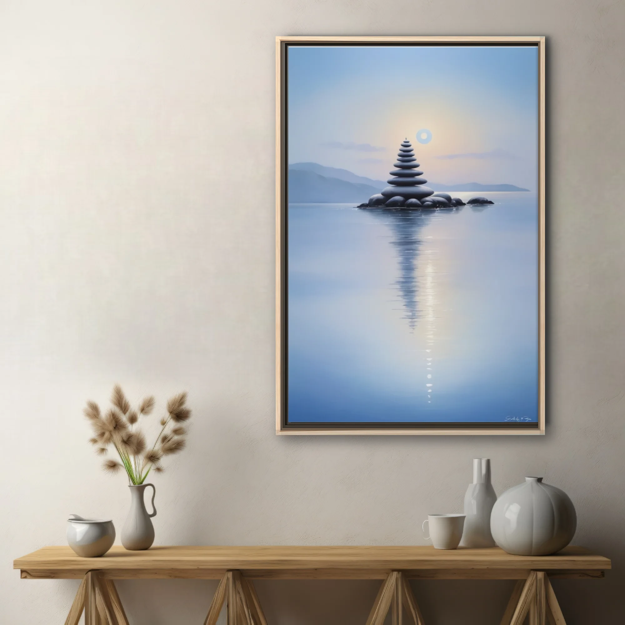 Minimalist zen stone stack reflected in calm blue water at dusk
