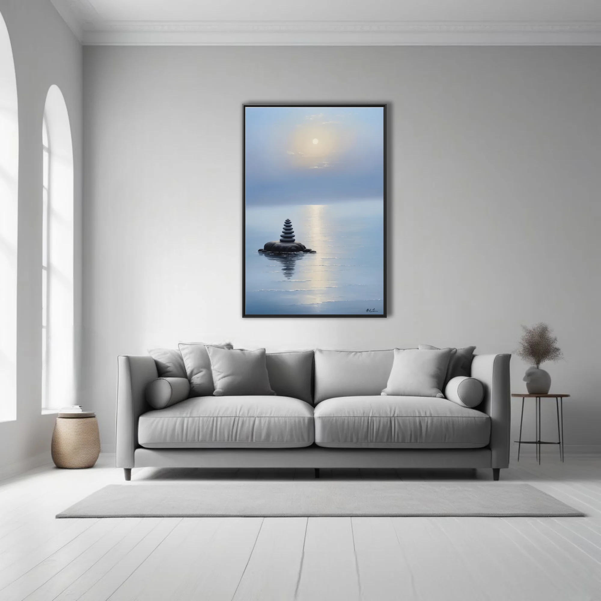 Minimalist zen stone cairn on still misty water with glowing sky