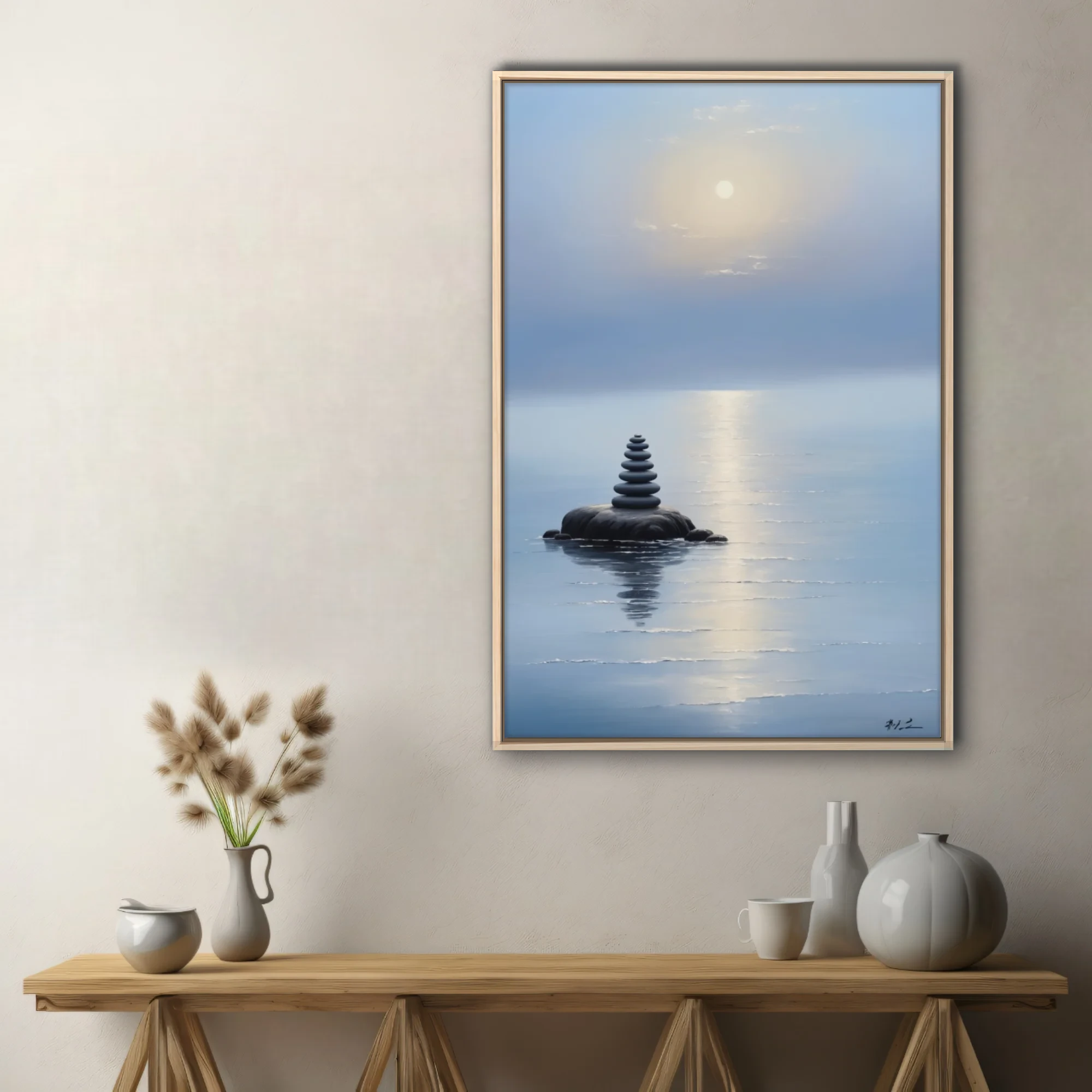 Minimalist zen stone cairn on still misty water with glowing sky