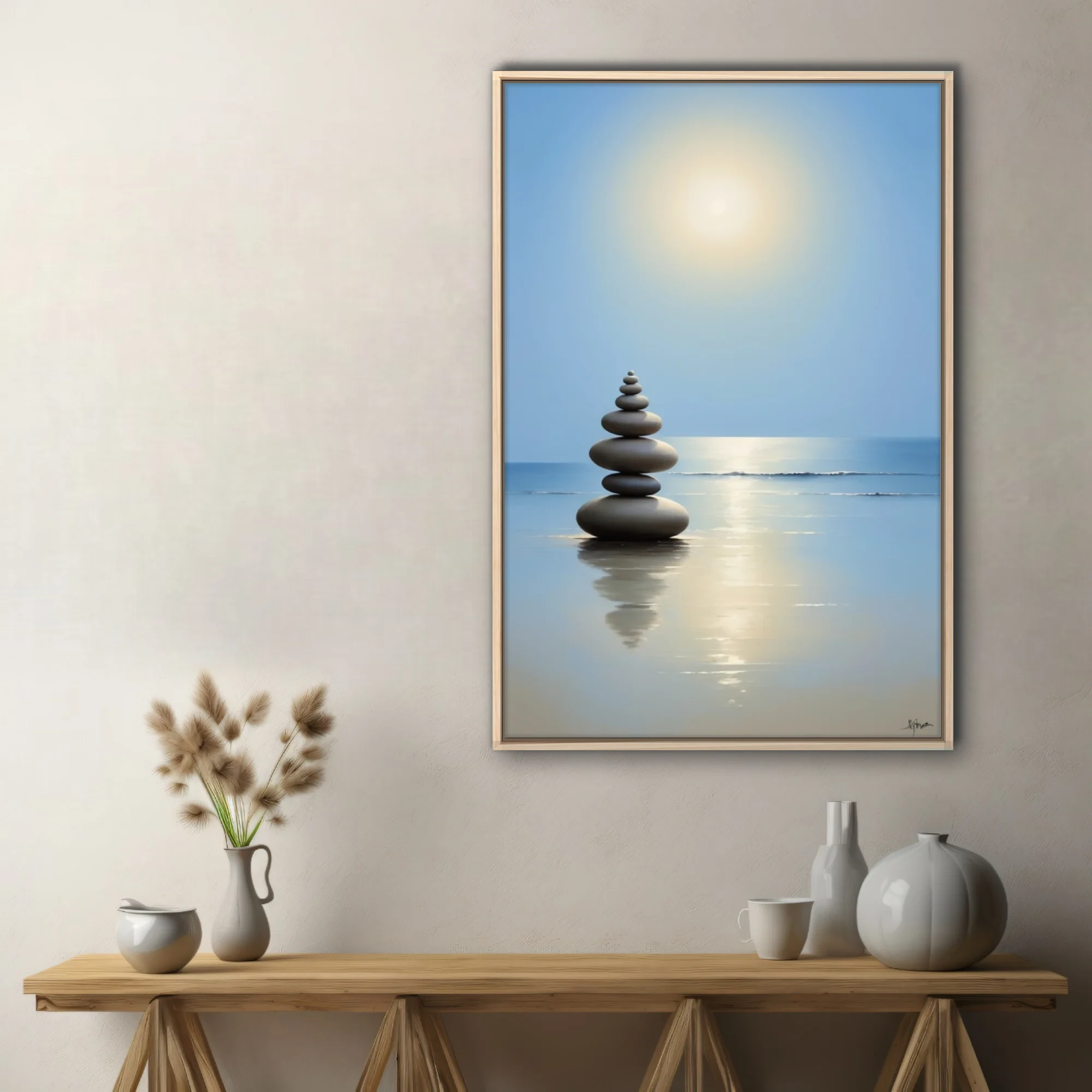 Minimalist zen stacked stones on calm reflective beach, soft blue and gold tones
