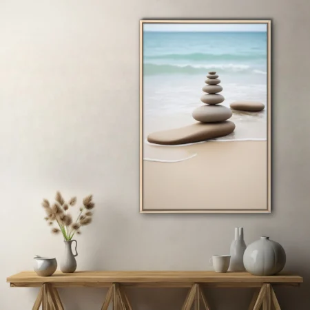 Zen balancing stones on sandy beach with soft seafoam waves