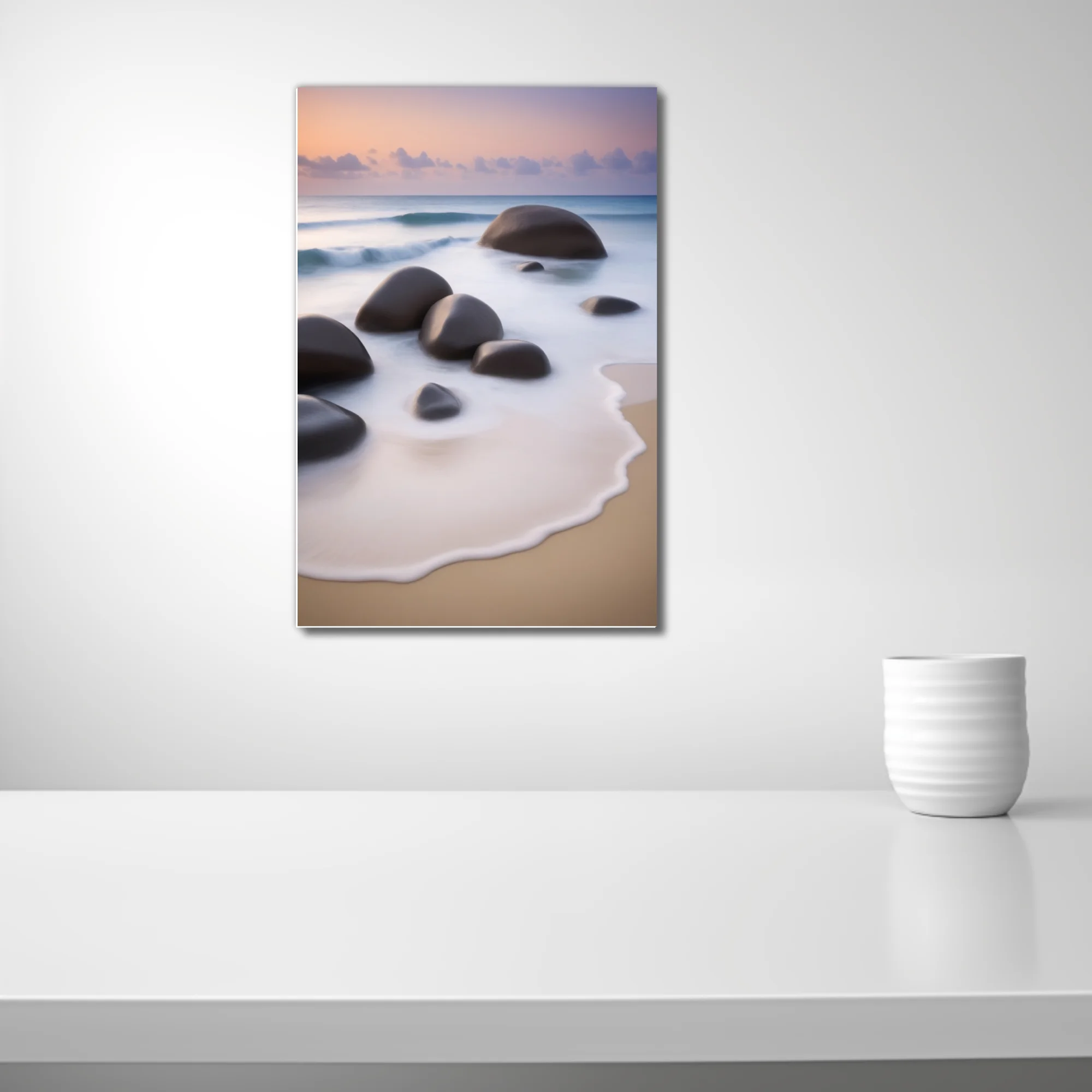 Long-exposure seascape with smooth boulders, silky foam, and pastel dusk sky
